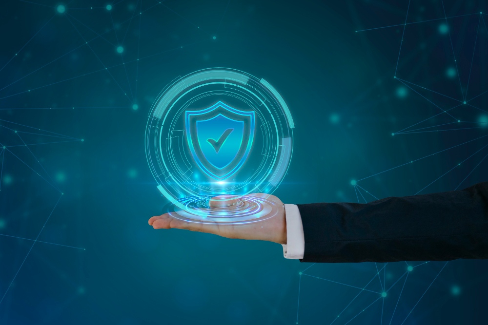 a hand holding a glowing shield