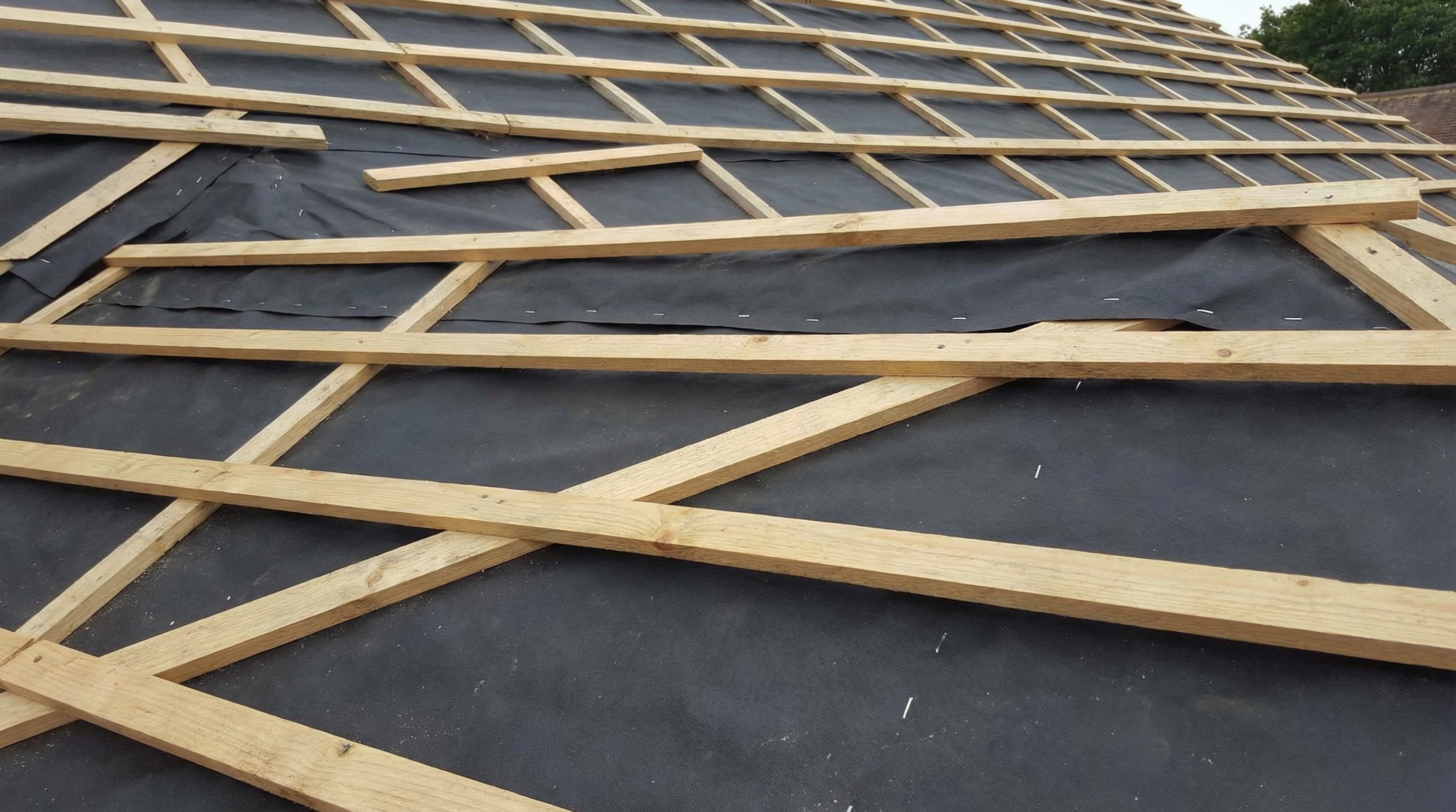 Step-by-step visual showing tile installation process from underlayment to finished ridge tiles