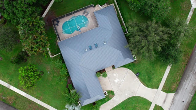 Aerial view of a house with pool in jupiter