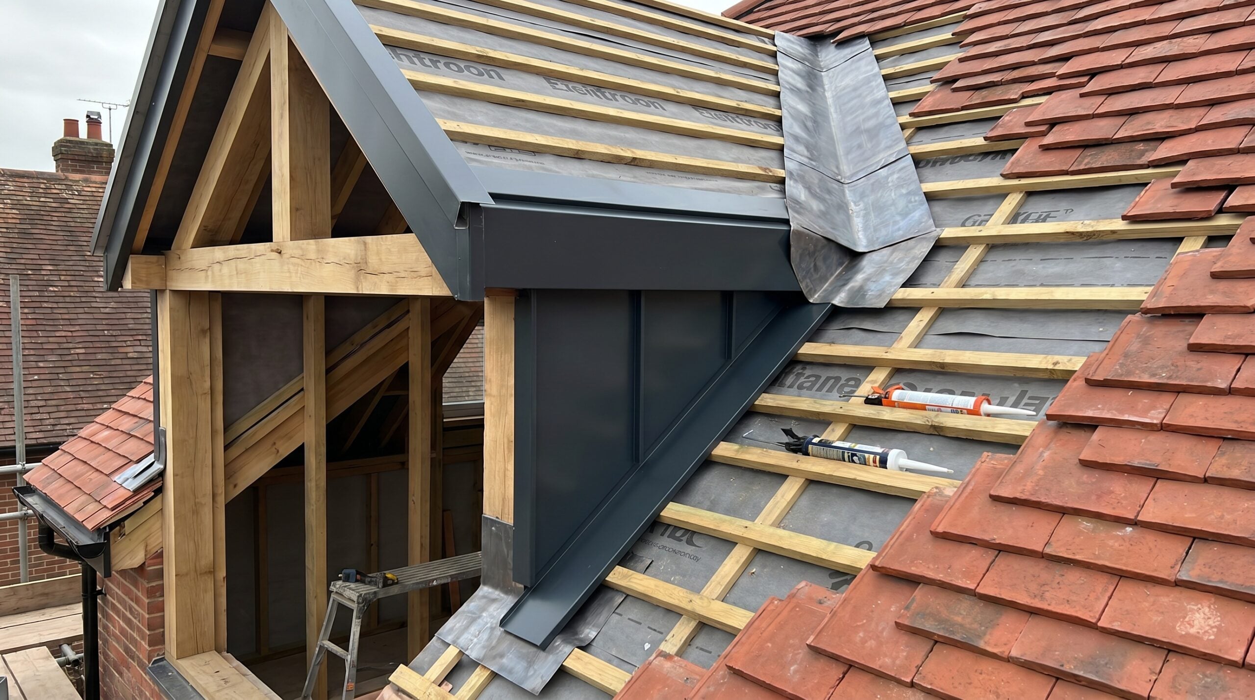 detailed view of roof extension flashing and integration work